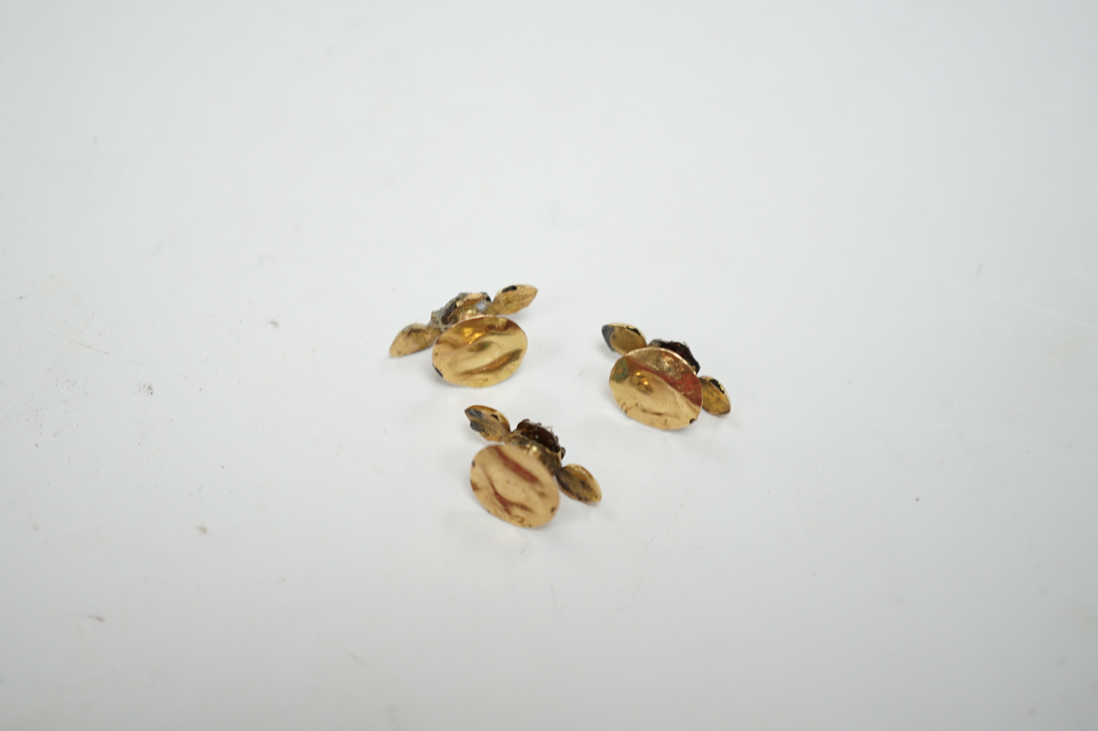 A small pair of antique yellow metal, two colour enamel, turquoise and seed pearl dress studs, 15mm and one other similar dress stud, gross weight 1.4 grams.